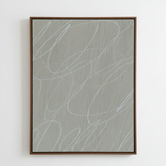 Framed abstract artwork with light gray/greige background and white gestural lines in a natural dark wood frame