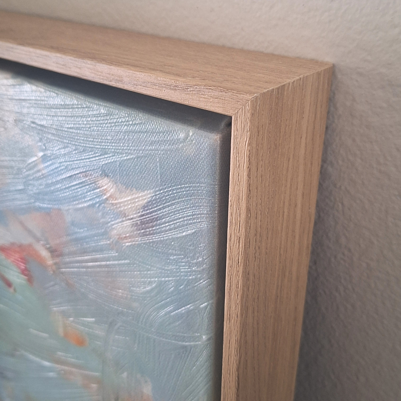 Close up detail of the wood frame craftsmanship of the 2.5" deep gallery frame and hand embellished brush strokes on the giclée art print.