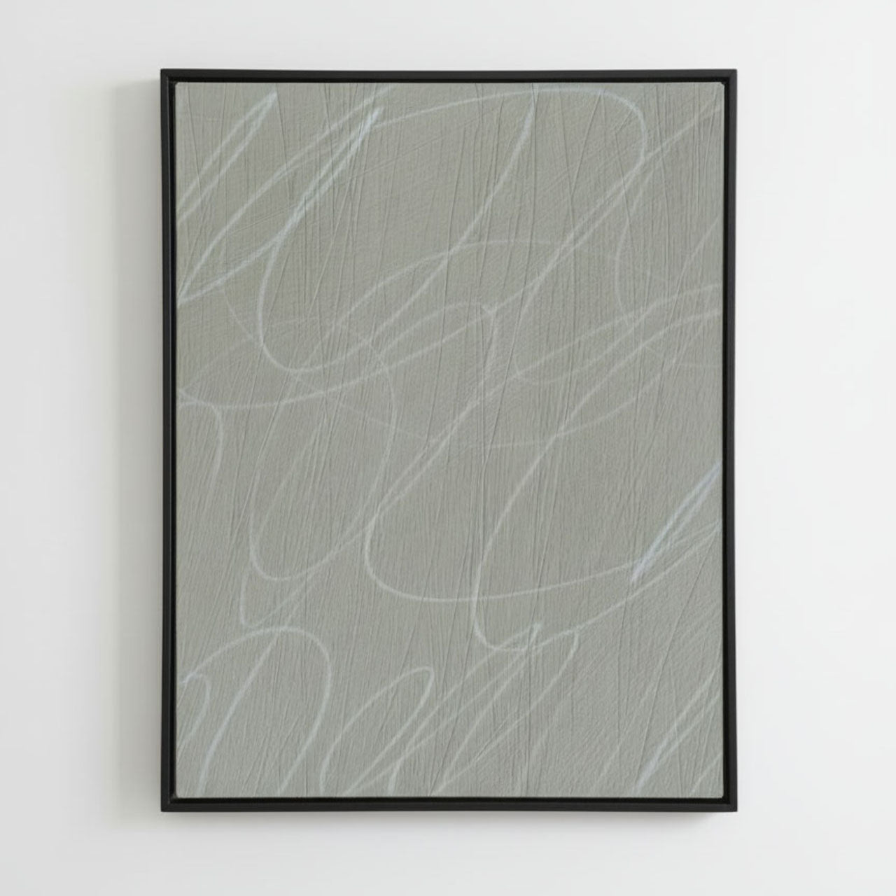 Framed abstract artwork with wavy lines in a black wood frame on a light gray background