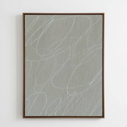 Framed abstract artwork with light gray/greige background and white gestural lines in a natural dark wood frame