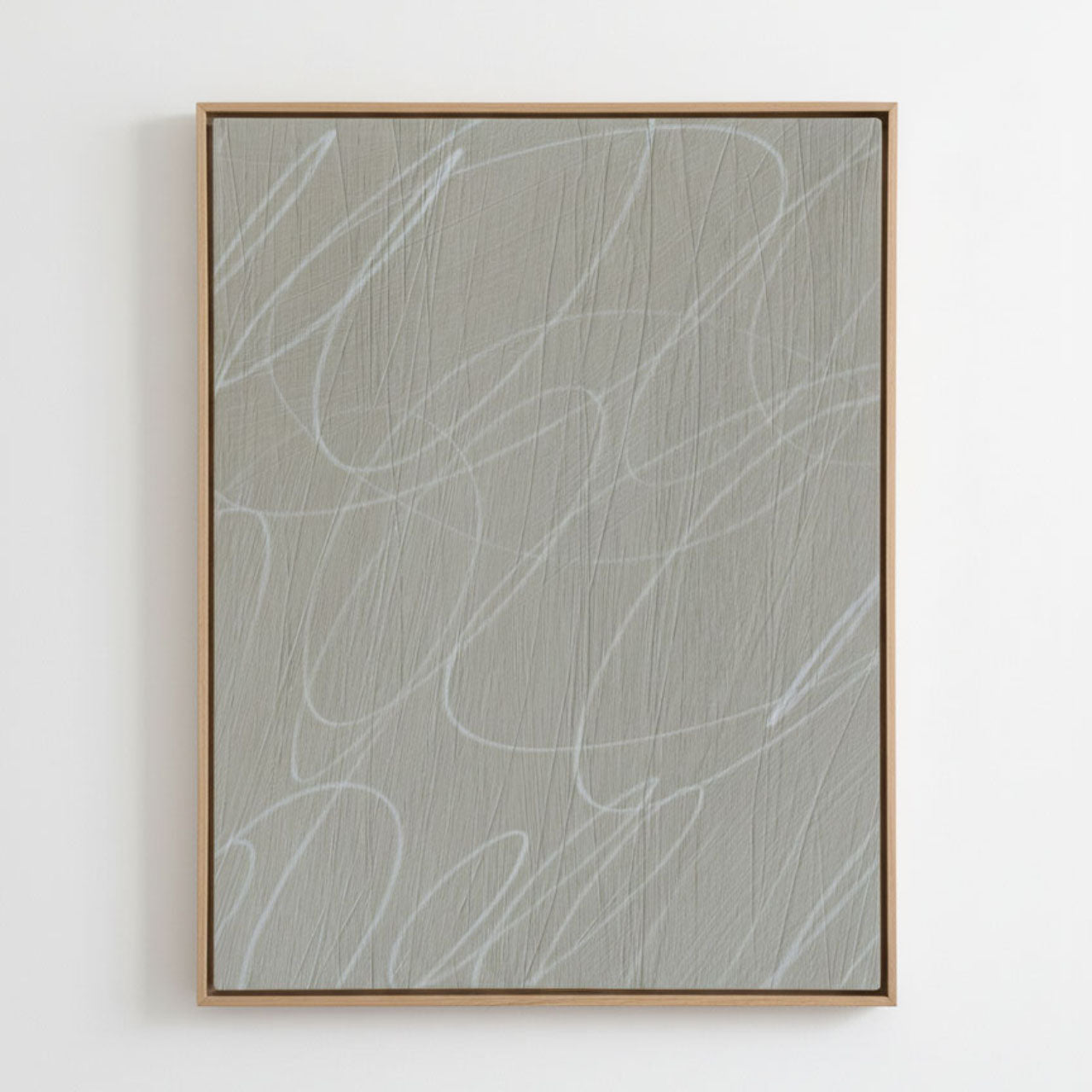 Framed abstract artwork with light gray background and white gestural lines in a natural wood frame. Abstract art piece with wavy lines on a light gray background, framed in wood.