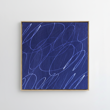 Framed abstract artwork with marine blue painted background and white gestural lines in a natural wood frame