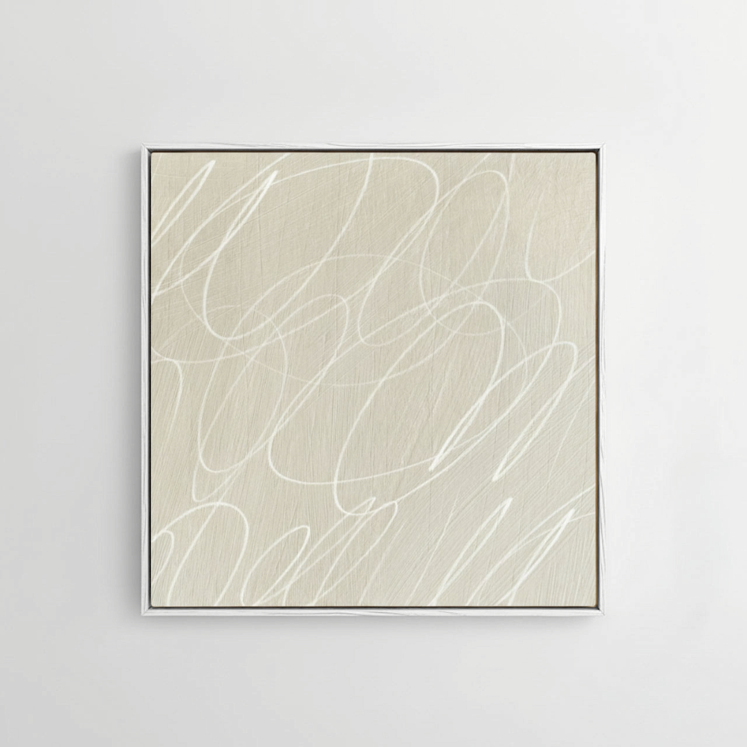 Framed abstract artwork with black background and white lines in a natural white wood frame