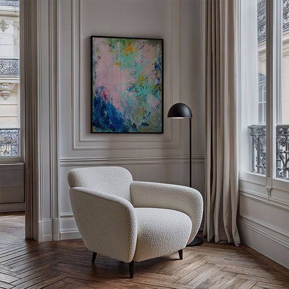 Traditional room with molding, with a abstract expressionist statement art print framed in black above rounded contemporary art deco inspired chair. Quiet luxury. Credits: ©2024 Emily Starck / Artmajeur.com x Art Collectiv
